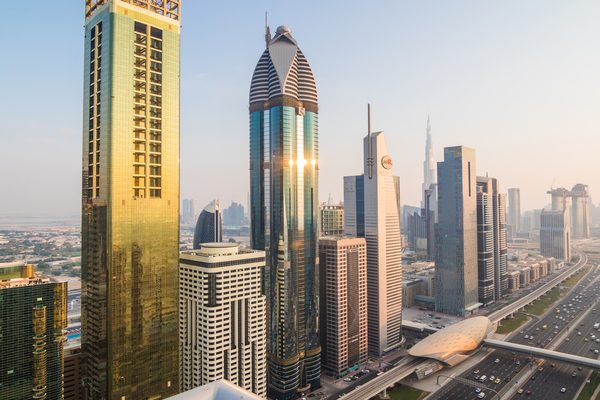 Dubai, UAE - October, 2018. Dubai skyline and downtown skyscrapers on sunset. Modern architecture with highrise buildings on world famous metropolis in United Arab Emirates